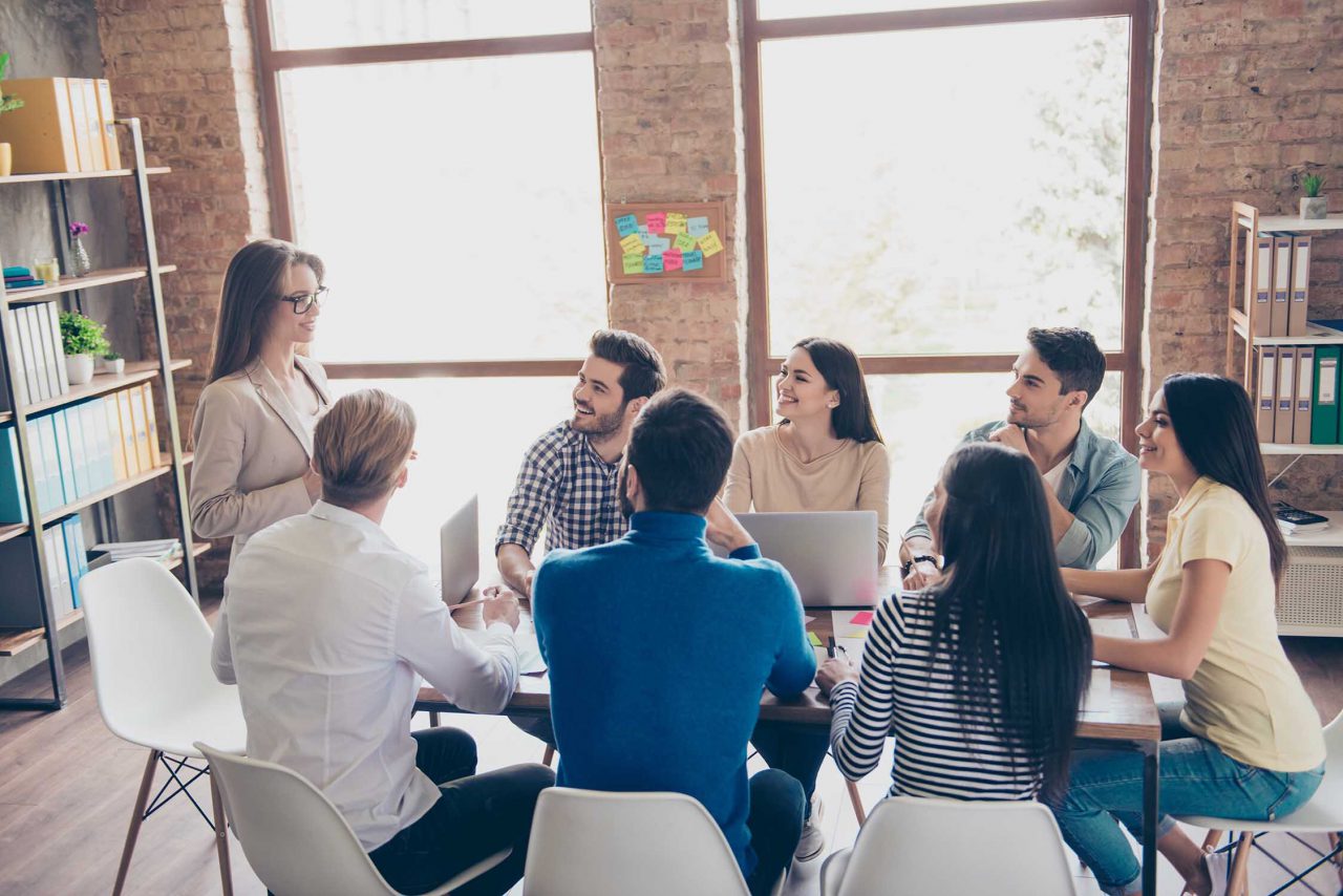 A group of users sit around the table at a workshop, instead of doing a focus group.