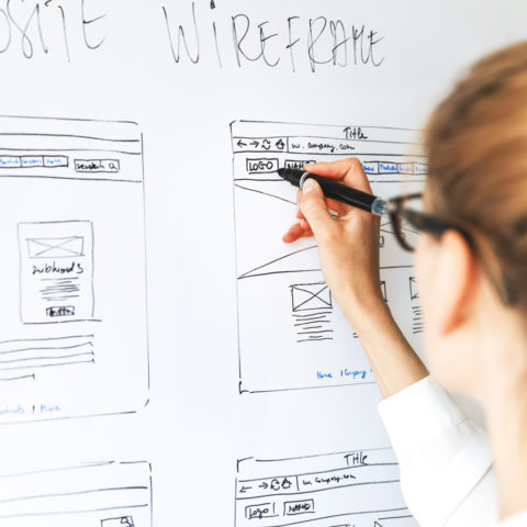 A UX designer is drawing a new wireframe.