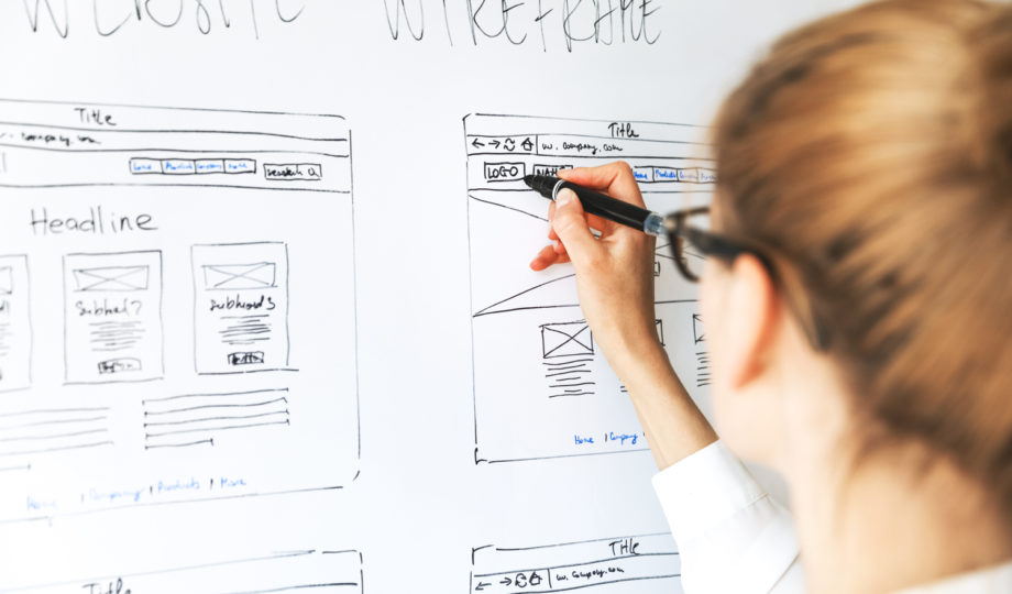 A UX designer is drawing a new wireframe.