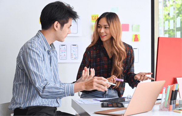 designer discussing their work over laptop