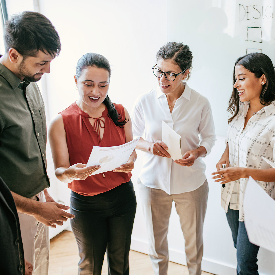 team members reviewing papers