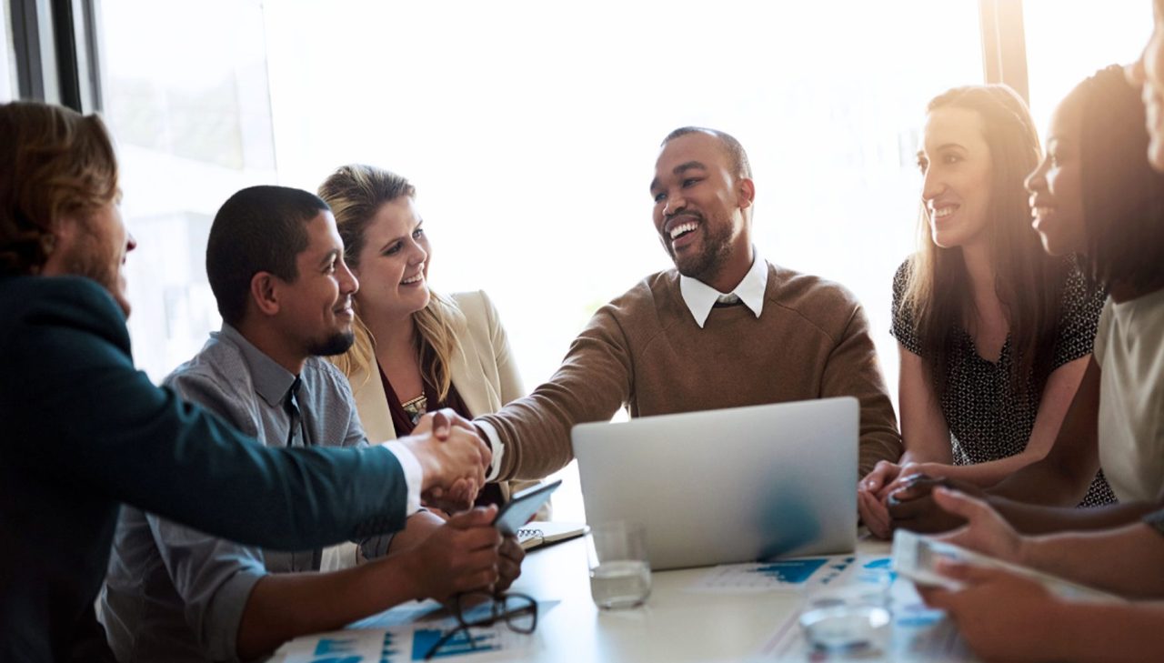 Image of people engaging in small group coaching as part of a UX training case study for a global think tank.