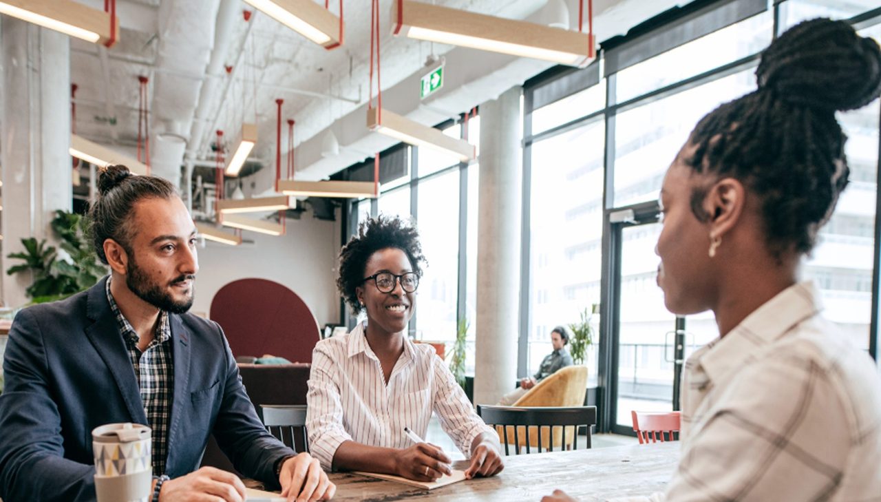 A UX designer staffed by Outwitly discussing the successful outcomes, for a case study on UX talent solutions for an investment firm.