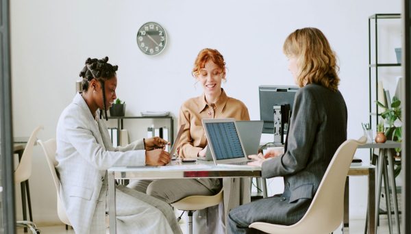 Image of a consultation between partners on a training program, for a design research training case study with a social impact agency.